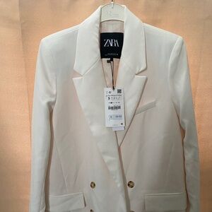 Medium length white blazer